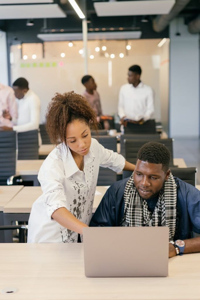 A business team collaborating on a project in a modern office setting.